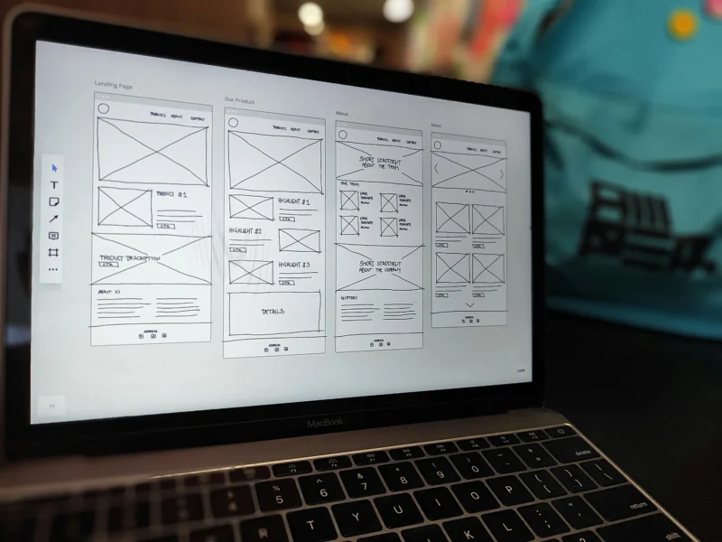UX wireframes on a laptop screen.