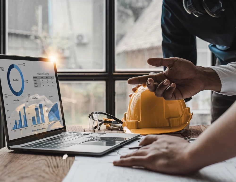 Construction workers reviewing analytics