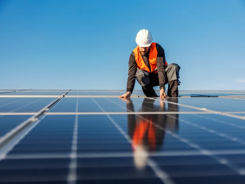 Man fitting solar panels